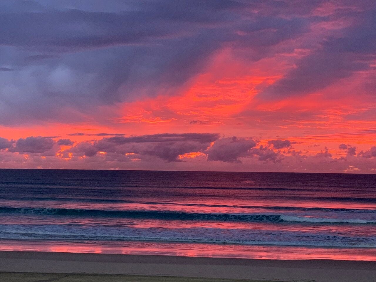 purple and red sunrise over ocean