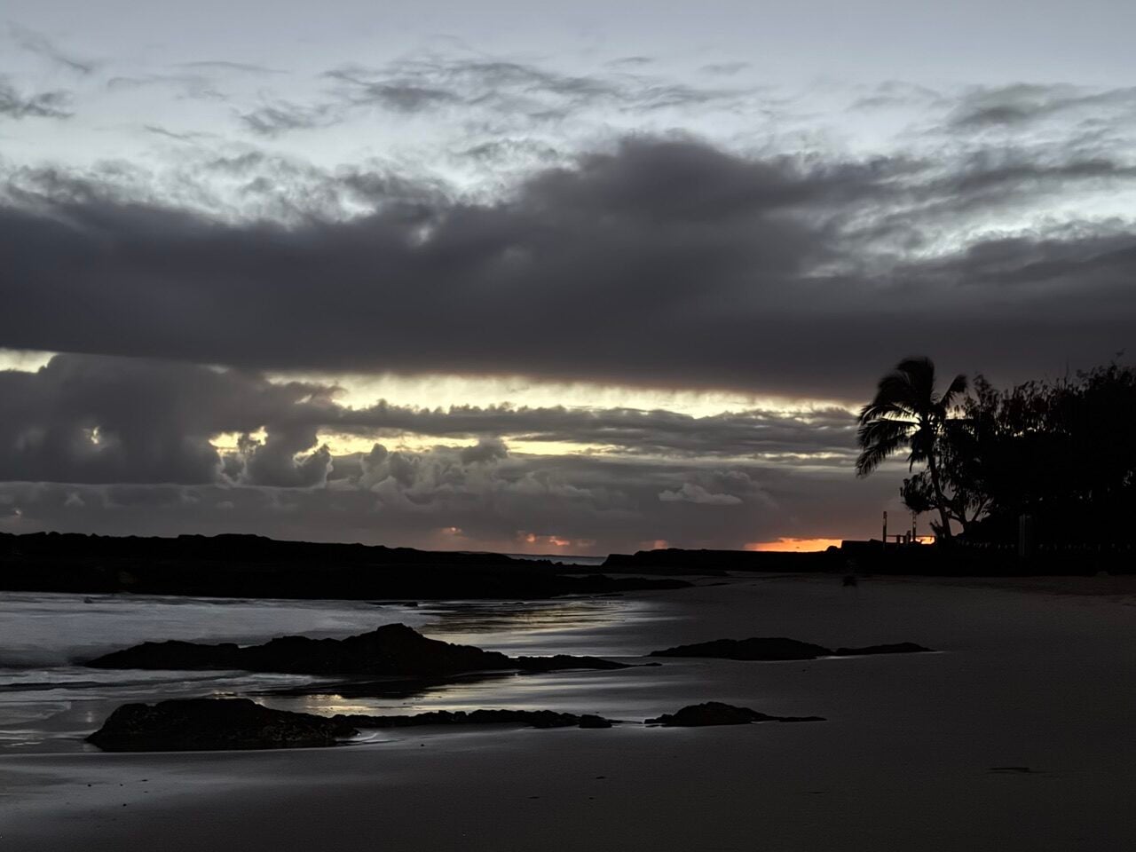 dark greys and a flsh of orange sunrise