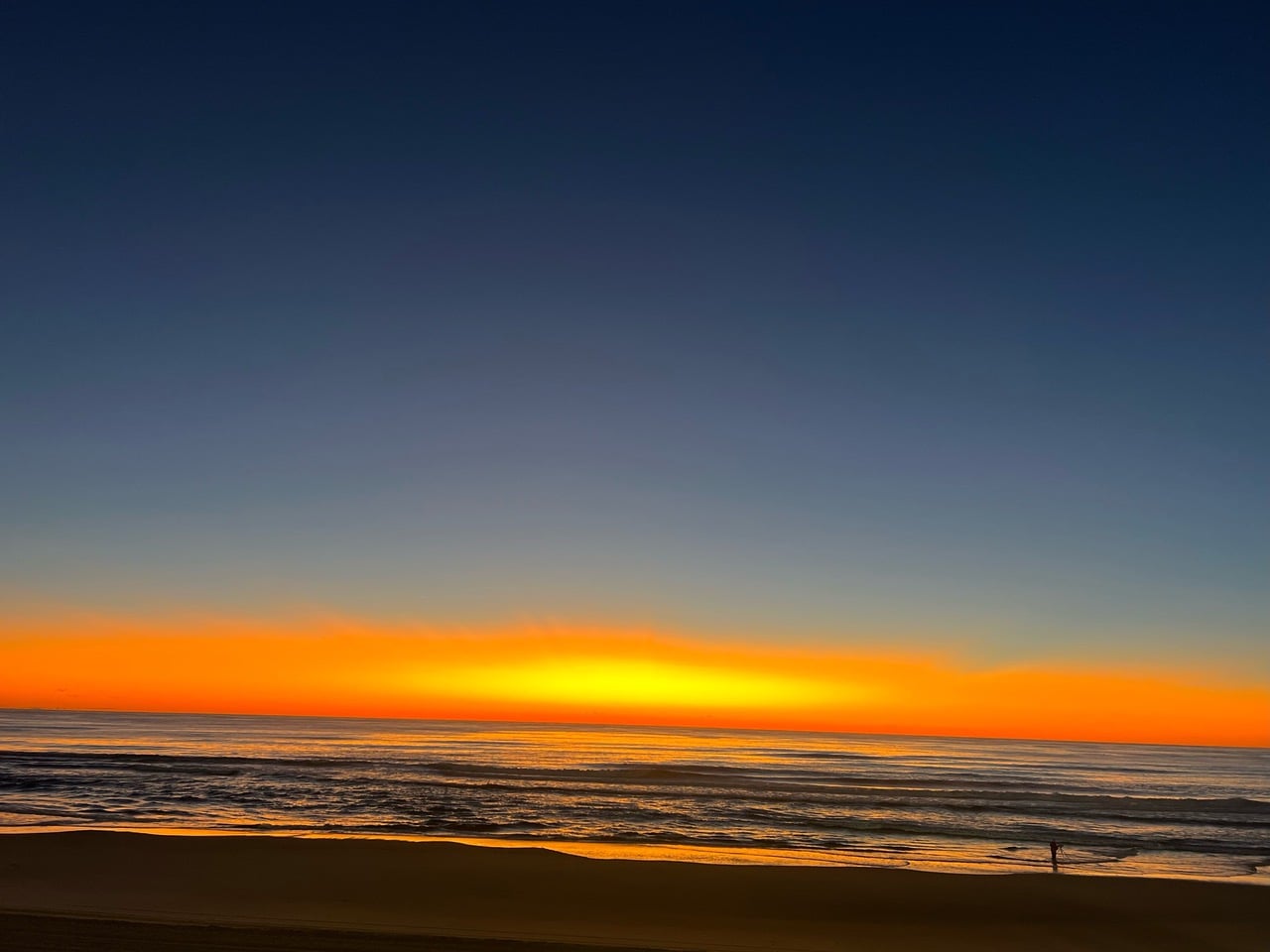 golden sun, like a bubble rising over the ocean