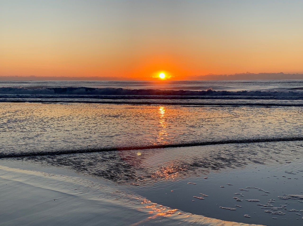 sunrise over ocean, breaking waves