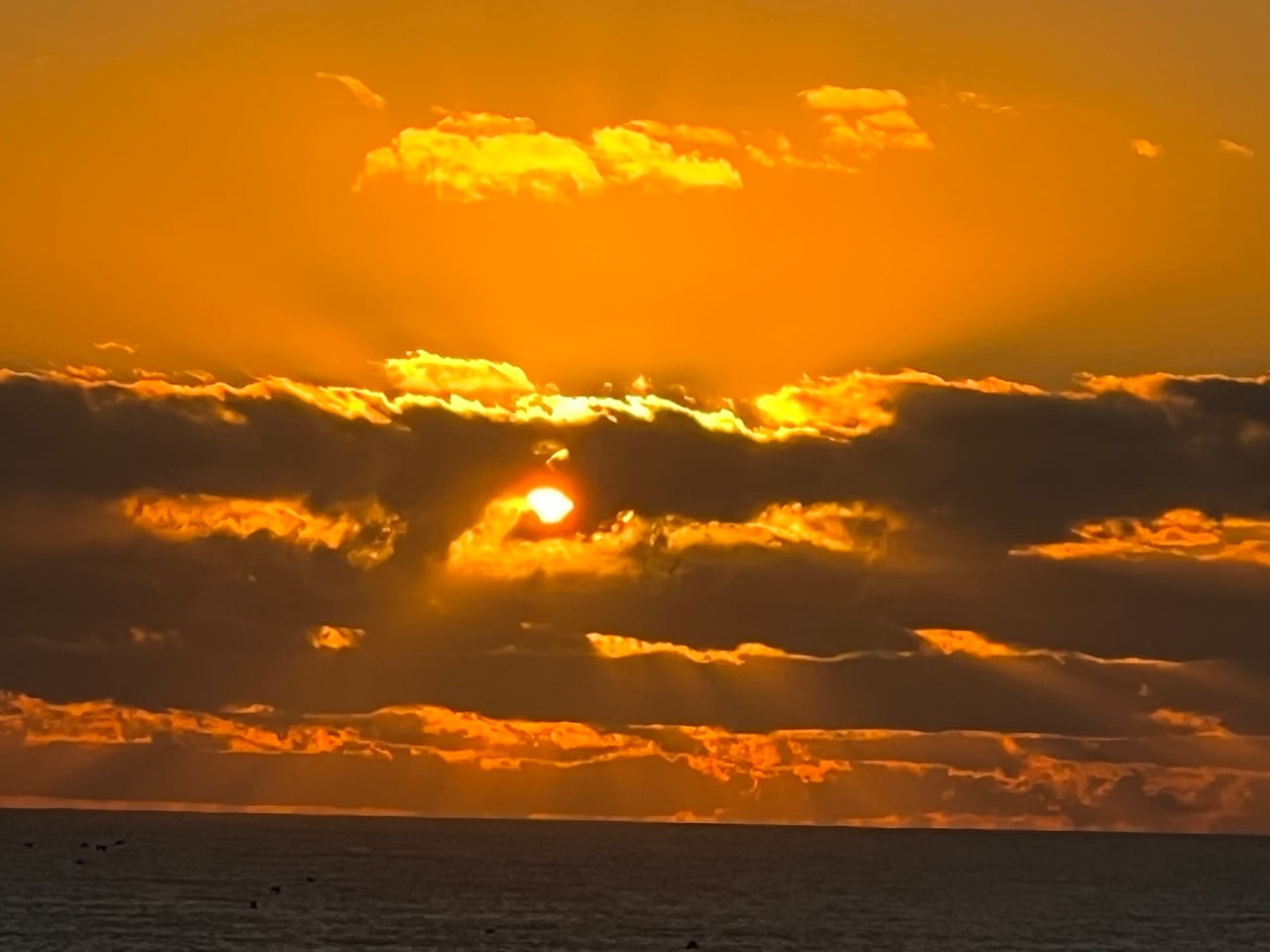golden sunrise through clouds
