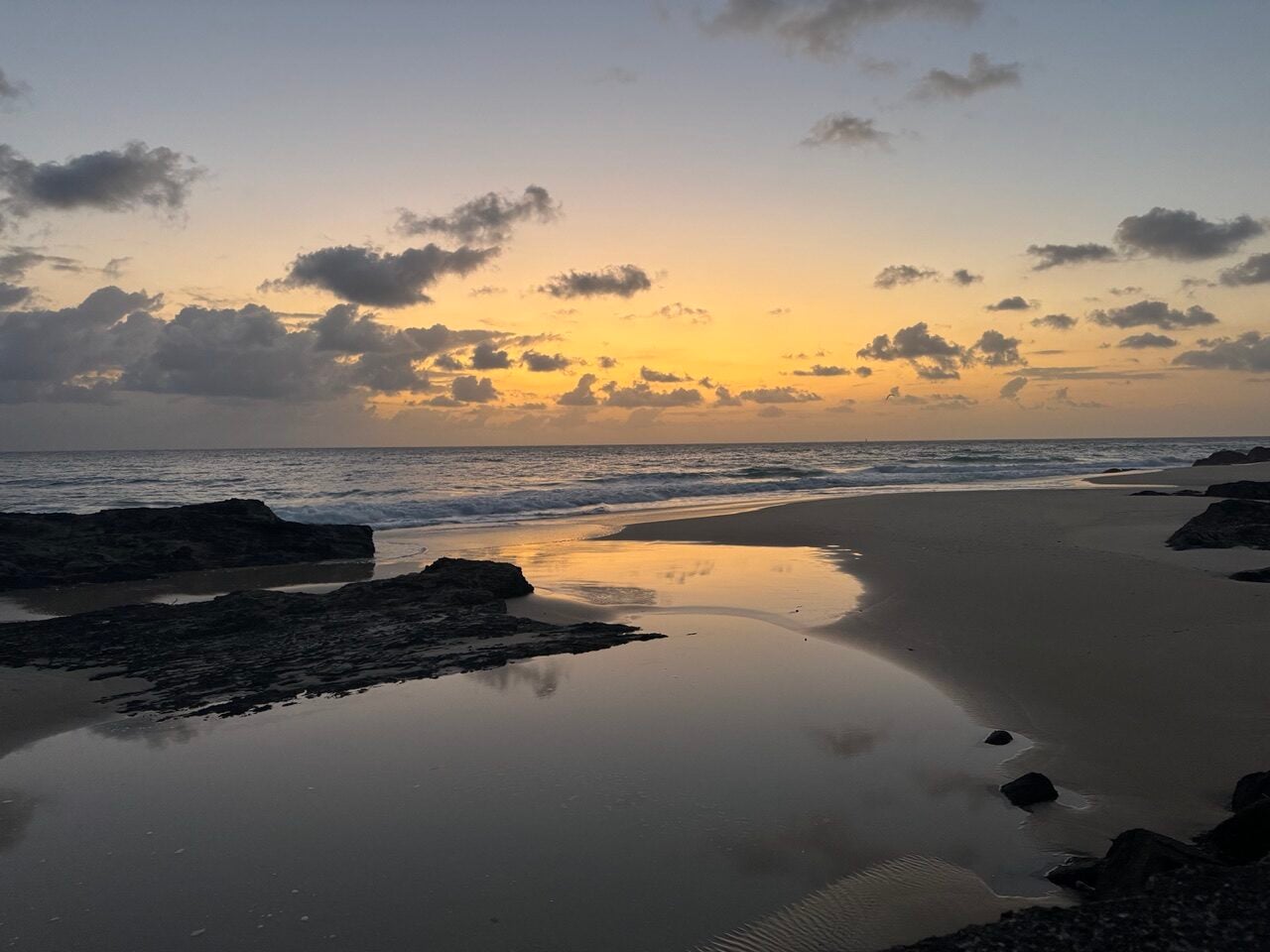 early dawn light, water, rocks, ocean